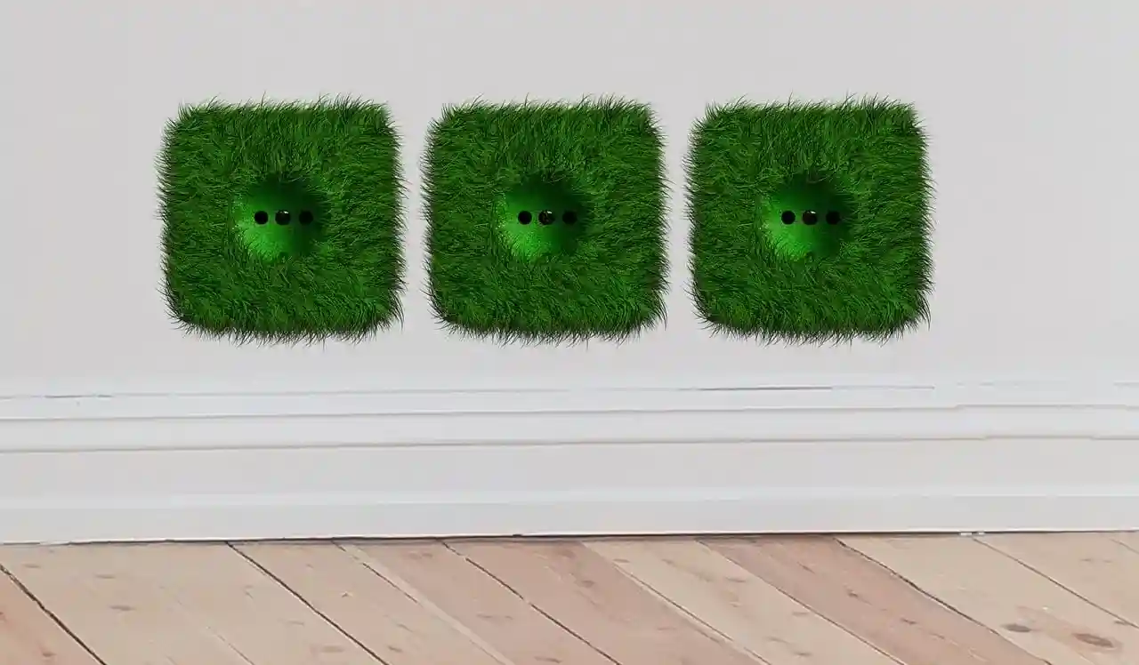 Drei quadratische, mit grünem, grasähnlichem Material überzogene Steckdosen sind an einer weißen Wand über einem Holzboden angebracht - ein von der Natur inspiriertes Design, das geschickt auf moderne Funktionalität wie stromvergleich gewerbe anspielt.